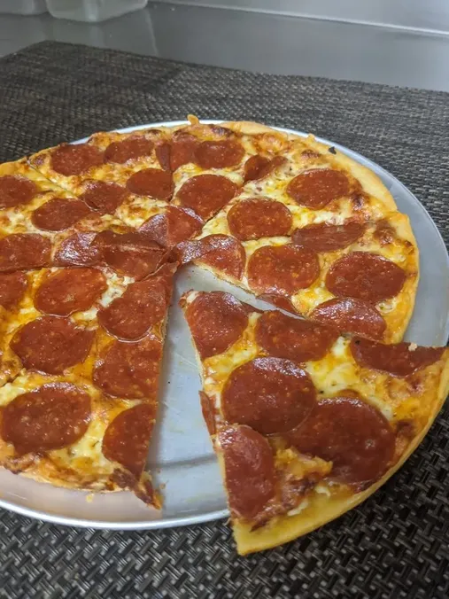 Pizza with Topping(s) + $ image